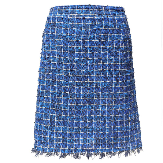 A blue tweed mini skirt with a white grid pattern and frayed fringe along the hem, shown against a plain white background.