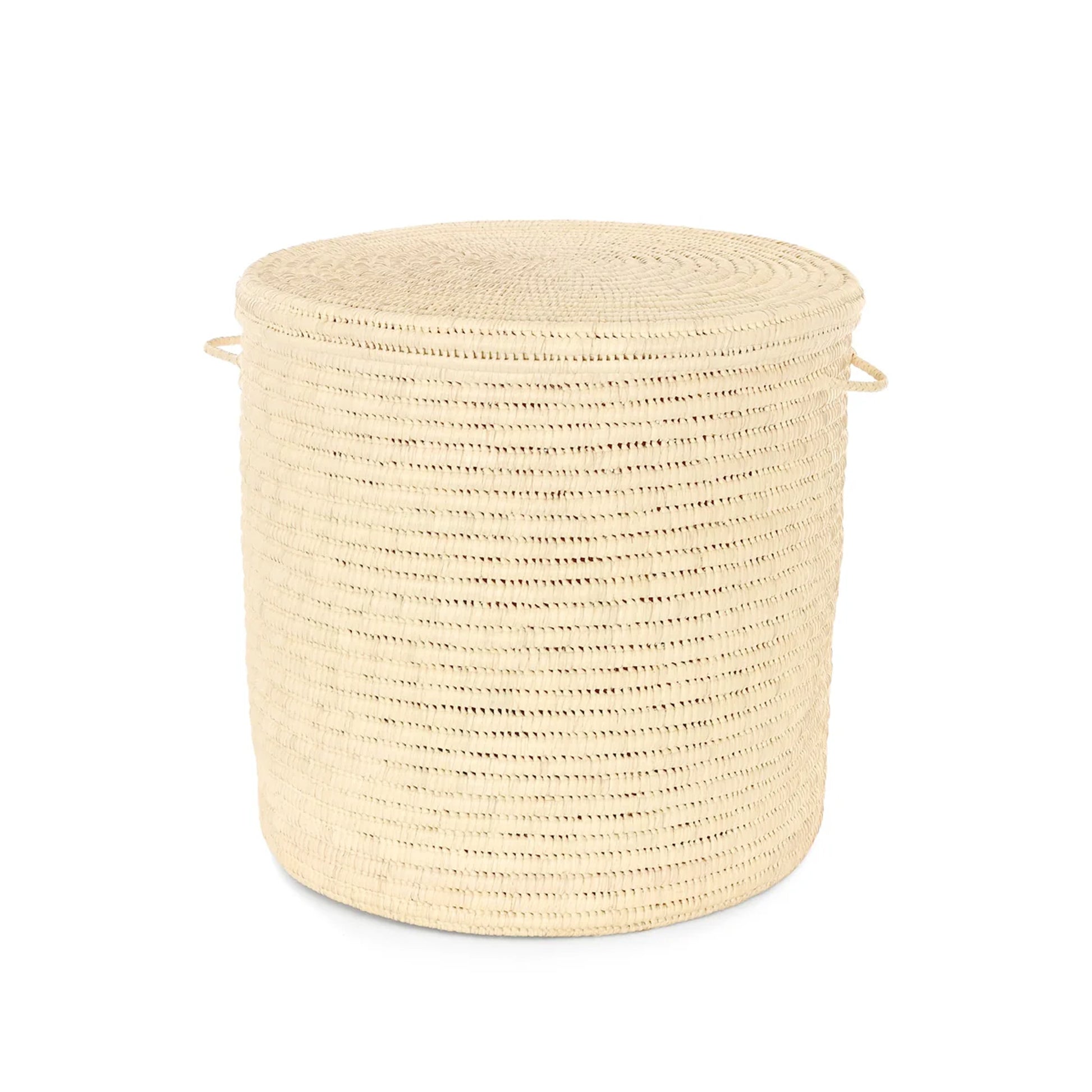 A natural woven straw laundry hamper with a matching lid, featuring two side handles, shown on a solid white background.