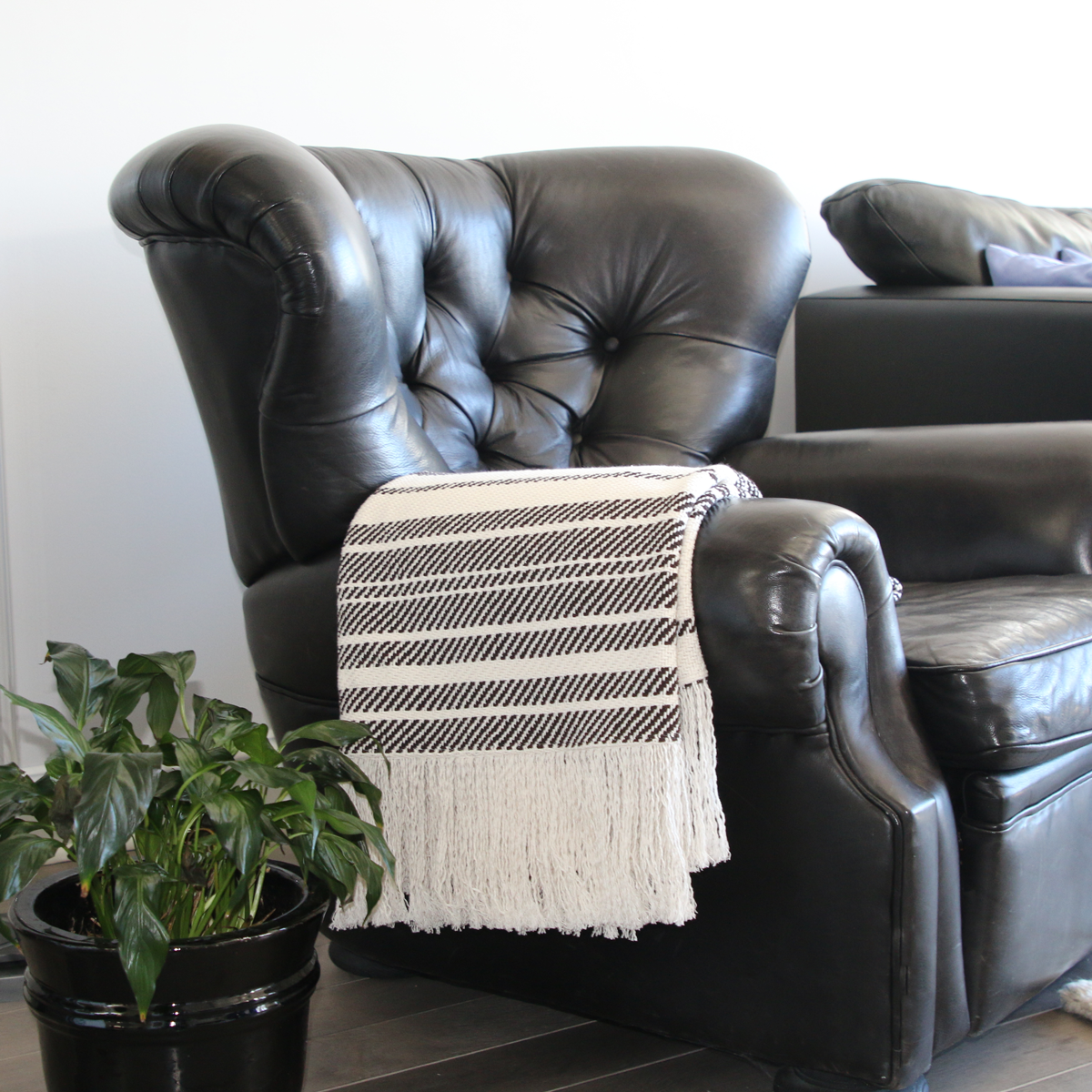     white-and-brown-striped-blanket-with-fringe